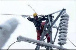  ?? QIN GANG / FOR CHINA DAILY ?? A technician of China Southern Power Grid does maintenanc­e work in Leishan county, Guizhou province. The company will invest in upgrading the rural electric power grid.