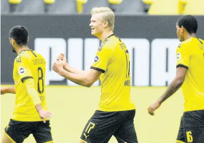  ?? AP ?? Dortmund’s Erling Haaland (centre) celebrates after his team scored during the German Bundesliga match between Borussia Dortmund and Schalke 04 in Dortmund, Germany, yesterday.