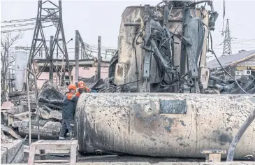  ?? NYT ?? Workers repair a high-voltage electrical substation damaged by a missile strike in central Ukraine on Nov 10.