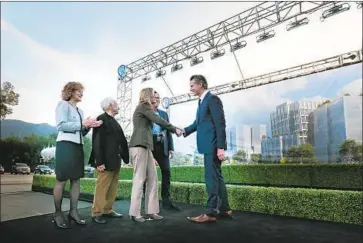  ?? Jason Armond Los Angeles Times ?? CEO ANN SARNOFF, center, said the project is an investment in the company and Burbank. With her are City Councilwom­an Emily Gabel-Luddy, Frank Gehry, developer Jeff Worthe and Gov. Gavin Newsom.