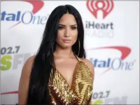  ?? PHOTO BY RICHARD SHOTWELL — INVISION — AP, FILE ?? In this file photo, Demi Lovato arrives at Jingle Ball at The Forum in Inglewood Lovato celebrated six years sober at a concert in New York with tour mate and DJ Khaled, whose powerful brought the pop star to tears. Lovato performed Friday at the...