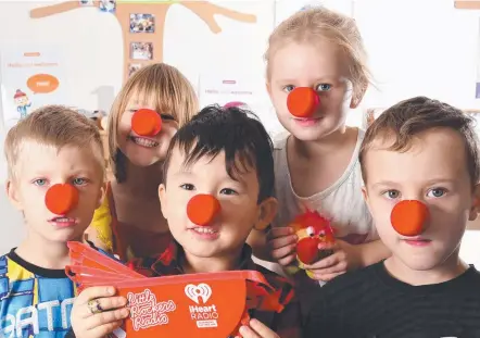  ?? Picture: STEVE HOLLAND ?? Travis Barry, Zoe Howell, Rastin Ali, Jade Nightingal­e and Dexter Parrott get ready for Red Nose Day.