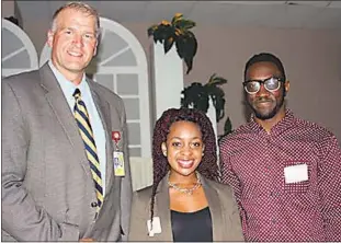  ?? SUBMITTED PHOTO ?? Tiarra McIlwain of Thomas Stone High School, center, is the 2016 Career Research and Developmen­t Student of the Year for Charles County Public Schools. Also pictured are Thomas Stone Principal Michael Meiser, left, and Demetre Wells, supervisor at...