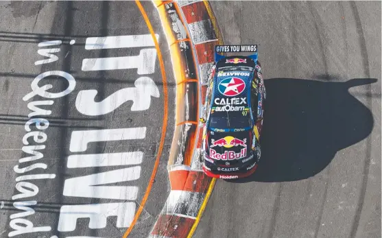  ??  ?? Shane Van Gisbergen fires his Commodore to the fastest time on day one at Surfers Paradise.