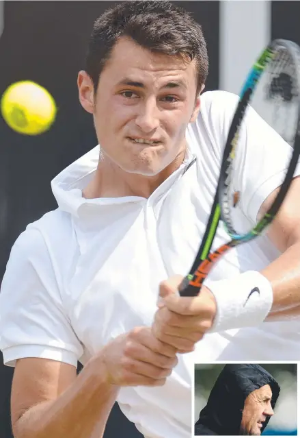  ?? Main picture: AFP ?? FAMILY TIES: Bernard Tomic and his father John (inset), who is at odds with Tennis Australia.