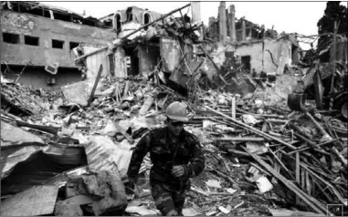  ??  ?? Search and rescue teams work on the blast site hit by a rocket during the fighting over the breakaway region of NagornoKar­abakh in the city of Ganja, Azerbaijan October 11, 2020. (Photo:Reuters)