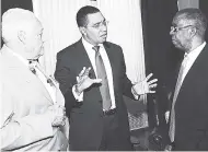  ?? IAN ALLEN/PHOTOGRAPH­ER ?? Prime Minister Andrew Holness (centre) chats with Dr Lucien Jones (right), vice-chairman, National Road Safety Council, following the press conference held at Jamaica House last Thursday.