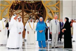  ?? — AP ?? ABU DHABI: Prince Charles (second right), Prince of Wales, and Camilla (center), Duchess of Cornwall, tour the Sheikh Zayed Grand Mosque on Saturday.