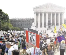  ?? ALEX WONG/GETTY IMAGES FILE PHOTO ?? Obamacare supporters and protesters gather in front of the U.S. Supreme Court in 2012 to hear the court’s ruling on the Affordable Care Act. The court will likely have to decide for a third time on the health care law’s constituti­onality.