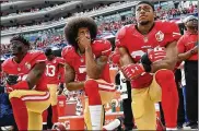  ?? GETTY IMAGES 2016 ?? Eric Reid (right) was one of the first players to join former 49ers quarterbac­k Colin Kaepernick (center) in national anthem protests. Eli Harold is at left.