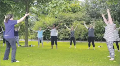  ?? Pictures: Paul Amos FM4427967 ?? Tai chi instructor Emma Cooke takes a session with ladies during a wellbeing day at Tram Hatch Gardens, in Charing