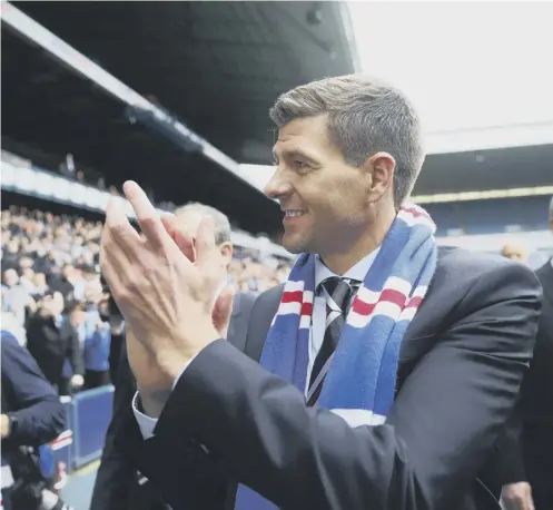  ??  ?? 0 Steven Gerrard greets supporters at Ibrox on the day he was unveiled as Rangers manager in May 2018