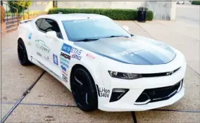  ?? ?? Mississipp­i State University’s ECOCAR 3 competitio­n car, a 2016 Chevrolet Camaro, sits in the plaza at “The Hub” of the MSU Research and Technology Corporatio­n. (Photo by Cal Brown, SDN)