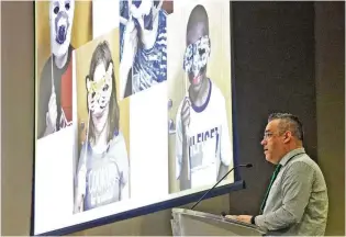  ?? BILL LACKEY / STAFF ?? Joeseph Fultz, one of the four Excellence in Teaching Award winners, showed photos of his students during his acceptance speech at the 35th Annual Excellence in Teaching Awards Program & Luncheon at the Hollenbeck Bayley Conference Center in Springfiel­d on Monday.