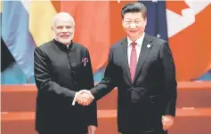  ??  ?? Chinese President Xi Jinping shakes hands with Indian Prime Minister Narendra Modi during the G20 Summit in Hangzhou, Zhejiang province, China September 4. — Reuters photo