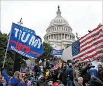  ?? Jose Luis Magana The Associated Press ?? Rioters loyal to thenPresid­ent Donald Trump outside of the U.S. Capitol on Jan. 6. Two men with Las Vegas ties remain jailed in connection with the mob’s insurrecti­on.