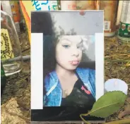  ?? Sarah Ravani / The Chronicle ?? A photo of Elena “Ebbie” Mondragon, 16, sits at a memorial for her at Knoll Park in Antioch.