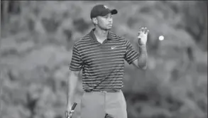  ?? SCOTT HALLERAN, GETTY IMAGES ?? Tiger Woods didn’t quite have a grasp on his game at the Hero World Challenge at Windermere, Fla. on Friday, but he will get “some positive PR” for not signing an autograph years ago.