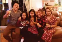  ??  ?? Nurse Jefferson De Vera with his daughters Pauline, Ella and Jenna, and his wife Rowena at home in Llanelli.