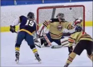  ?? SAM STEWART - DIGITAL FIRST MEDIA ?? Spring-Ford’s Joseph Temoyan scores past Boyertown goalie Brandon Benson during the first period of the ICSHL Pioneer title game.