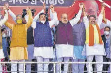  ?? PTI ?? Amit Shah, Suvendu Adhikari (2nd from left) and other leaders at a rally in West Bengal’s West Midnapore district on Saturday.