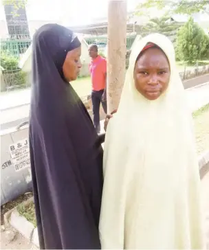  ??  ?? Halima escorts her daughter Basira to beg for alms