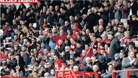  ??  ?? Show of support Accies fans gather to pay tribute to fellow fan Graham