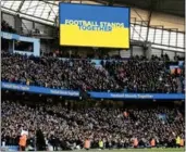  ?? Photo: AFP ?? A “Football Stands Together” message is displayed in the colours of the Ukrainian flag before the Manchester derby last Sunday (Mar 6).