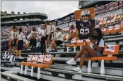  ?? BUTCH DILL — THE ASSOCIATED PRESS ?? Auburn students are socially distanced as they wait Saturday for the start of an NCAA college football game against Kentucky in Auburn, Alabama.