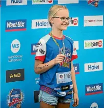  ?? GRANT MATTHEW/FAIRFAX NZ ?? Tabitha George, 10, poses with her medal.