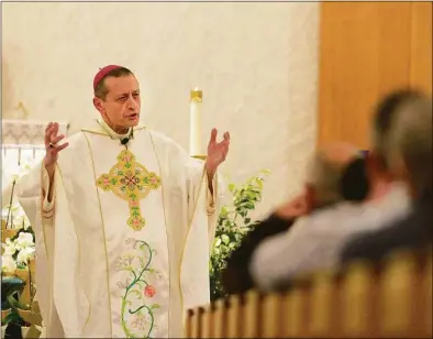  ?? H John Voorhees III / Hearst Connecticu­t Media ?? Bishop Frank Caggiano, Roman Catholic Diocese of Bridgeport, delivers the homily during Mass at St. Rose of Lima Church Dec. 14 in Newtown. The Mass marked the 10th anniversar­y of the mass shooting at Sandy Hook Elementary School.