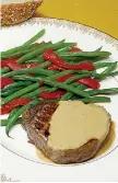  ?? Tribune News Service ?? ■ Beef tenderloin in cognac sauce with French green beans.