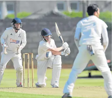  ??  ?? Forfarshir­e’s Christian Robertson strikes the boundary.