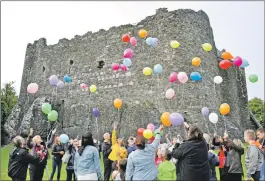  ??  ?? The balloons and butterflie­s that were released (16_T30_Butterflyr­elease01/06) and, above right, Kayla and her younger brother Ruairidh at Dunstaffna­ge Castle, where the little girl loved to play.