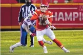  ?? JEFF ROBERSON/ASSOCIATED PRESS ?? Kansas City Chiefs quarterbac­k Patrick Mahomes (15) scrambles ahead of Buffalo Bills defensive end AJ Epenesa (57) during the first half of the AFC championsh­ip game Sunday.