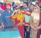  ??  ?? Family members paying tributes to sepoy Mandeep Singh as his body arrived at his native village Alampur in Lehragaga tehsil of Sangrur district on Sunday. Congress leader and former CM Rajinder Kaur Bhattal is also seen. BHARAT BHUSHAN/HT