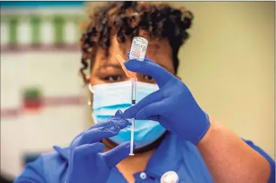  ?? JOSEPH PREZIOSO / AFP via Getty Images ?? Nurse Natalie O’Connor loads syringes with the Moderna Covid-19 on Feb. 12, 2021.