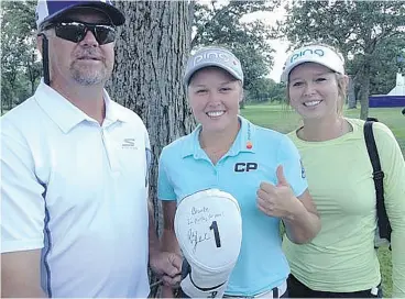  ?? CHRIS STEVENSON ?? Dave, Brooke and Brittany Henderson with Brooke’s driver head cover signed by Phil Mickelson. Brooke competed against Mickelson in a skills competitio­n on Monday.