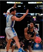  ?? EMILEE CHINN/GETTY IMAGES ?? Cal's Kareem South passes the ball as Duke's Wendell Moore Jr. (0) applies pressure at Madison Square Garden in New York in 2019.