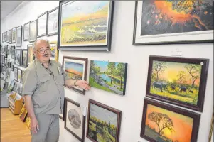  ?? SHARON MONTGOMERY-DUPE/CAPE BRETON POST ?? Gerd Bruckschwa­iger shows some of his art work in his art gallery located in his tailor shop on Grand Lake Road in Sydney.