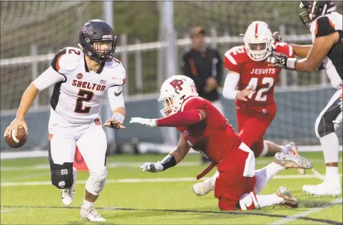  ?? Mark Conrad / For Hearst Connecticu­t Media ?? Shelton quarterbac­k Jake Roberts (2) scrambles in the backfield during Friday’s game against Fairfield Prep at Fairfield University. The Gaels held on for a 10-7 win.