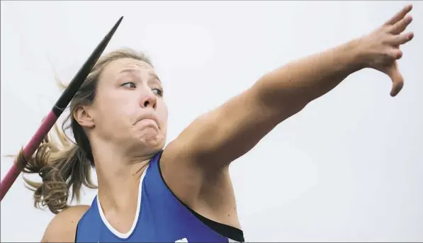  ?? Steph Chambers/Post-Gazette photos ?? Connellsvi­lle’s Madison WIltrout seized a piece of history Saturday by winning the PIAA Class 3A girls javelin for the fourth time in a row at Shippensbu­rg.