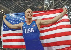  ?? Associated Press ?? World champion: United States' Sam Kendricks celebrates after winning the gold medal in the men's pole vault final during the World Athletics Championsh­ips in London Tuesday.