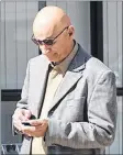  ?? RYAN ROSS/THE GUARDIAN ?? Former high school music teacher Roger Jabbour stands outside the provincial courthouse in Charlottet­own Friday after a judge found him guilty of three sex offences.