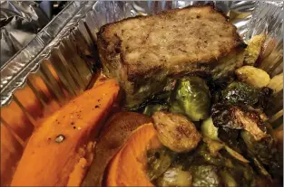  ??  ?? The meatloaf with roasted sweet potatos and Brussels sprouts is a treat from Monterey’s Alta Bakery + Cafe.
