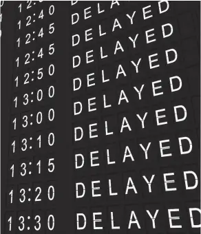  ??  ?? > A flight informatio­n board showing all flights delayed. See question 1