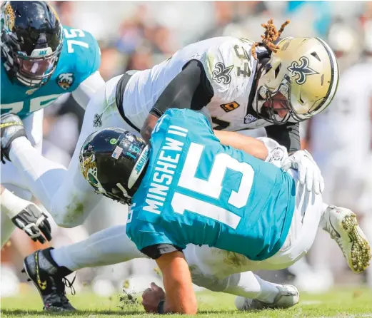  ?? GETTY IMAGES ?? Saints defensive end Cameron Jordan sacks Jaguars rookie quarterbac­k Gardner Minshew in the third quarter Sunday at TIAA Bank Field.