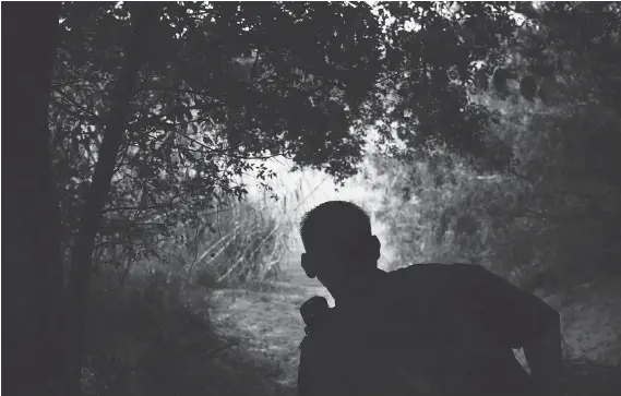  ?? PHOTOS: CAROLYN VAN HOUTEN/WASHINGTON POST ?? Border Patrol agent Robert Rodriguez watches along the Rio Grande, near McAllen, Texas, one of the busiest areas for illegal crossings.