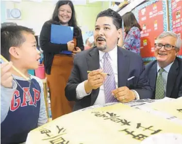  ?? SUSAN WATTS / NEW YORK DAILY NEWS ?? Schools Chancellor Richard Carranza (shown in visit to Public School 1 in Chinatown) says he is planning a “ground-up, community-based approach to examining options for students.”