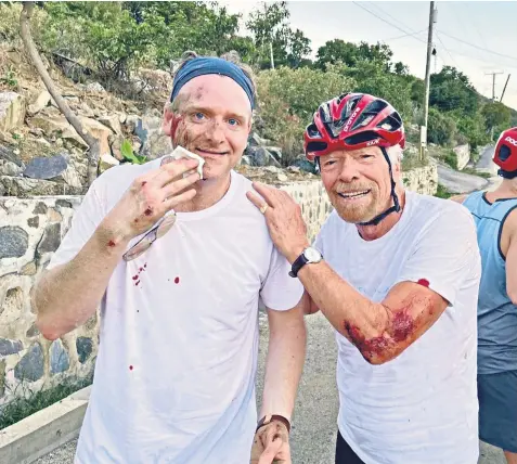  ?? ?? Sir Richard Branson, right, suffered injuries to his hip and elbow in the crash while cycling with a friend on the Caribbean island of Virgin Gorda